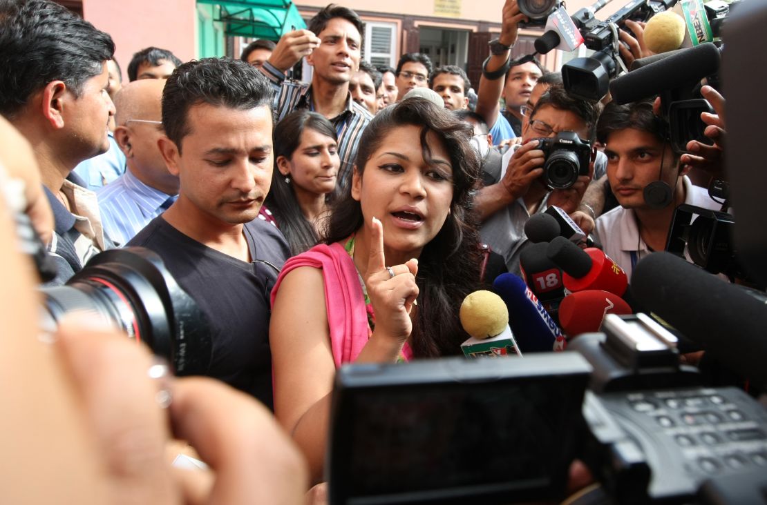Sobhraj's wife, Nihita Biswas, speaks with media outside the Supreme Court in Kathmandu on July 30, 2010. 