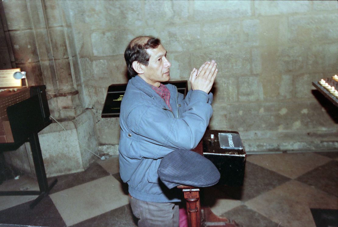 Sobhraj prays at Notre-Dame Cathedral, Paris in 1997 after being released from jail in India. 
