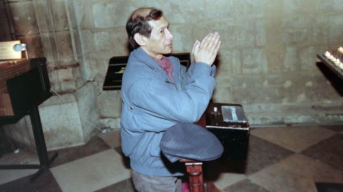 Sobhraj prays at Notre-Dame Cathedral, Paris in 1997 after being released from jail in India. 