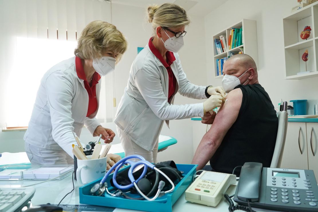 A health care worker is inoculated against Covid-19 with the AstraZeneca vaccine in the German state of Brandenburg on March 03, 2021.