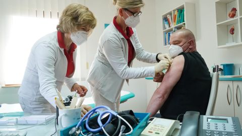 A health care worker is inoculated against Covid-19 with the AstraZeneca vaccine in the German state of Brandenburg on March 03, 2021.