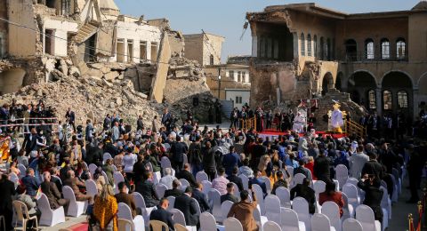 People attend the Pope's prayer in Mosul on Sunday. ISIS controlled the city between 2014 and 2017.