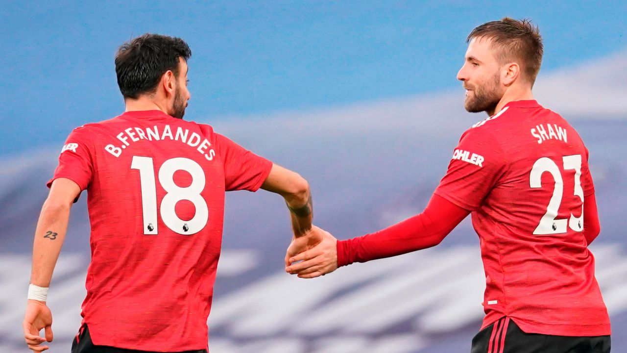 Luke Shaw (R) celebrates scoring Manchester United's second goal.