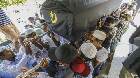 People carry the coffin of National League for Democracy member Khin Maung Latt during his funeral in Muslim tradition held by the members of National League for Democracy (NLD) party in Yangon, Myanmar, on March 7.