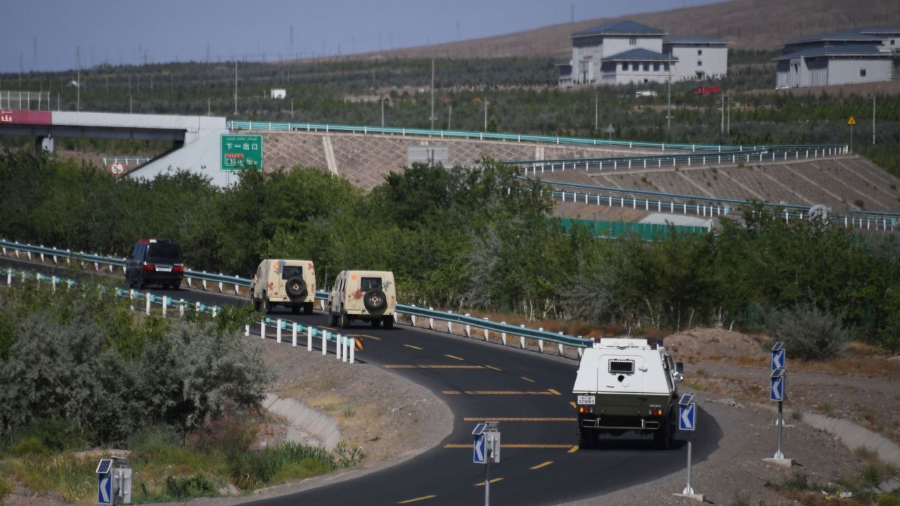 Paramilitary police vehicles on a road in Artux in China's northwest Xinjiang region in June, 2019.