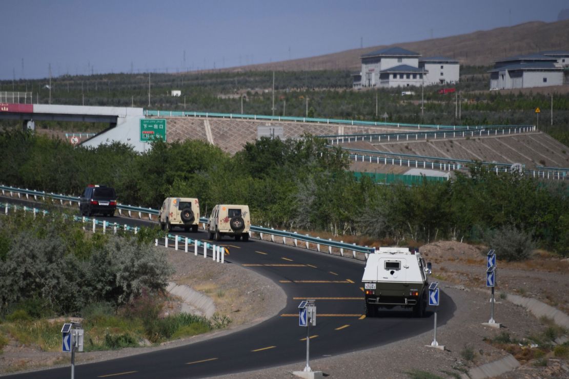 Paramilitary police vehicles on a road in Artux in China's northwest Xinjiang region in June, 2019.
