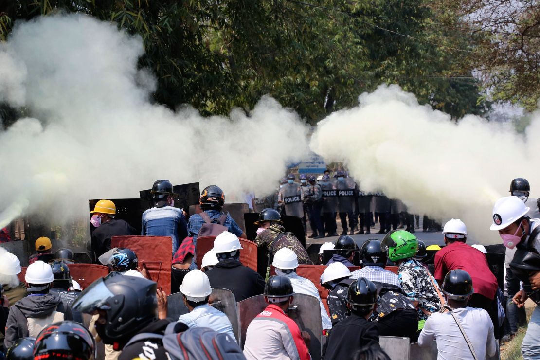 Anti-coup protesters discharge fire extinguishers to counter the impact of the tear gas fired by police during a demonstration in Naypyitaw, Myanmar, on March 8.