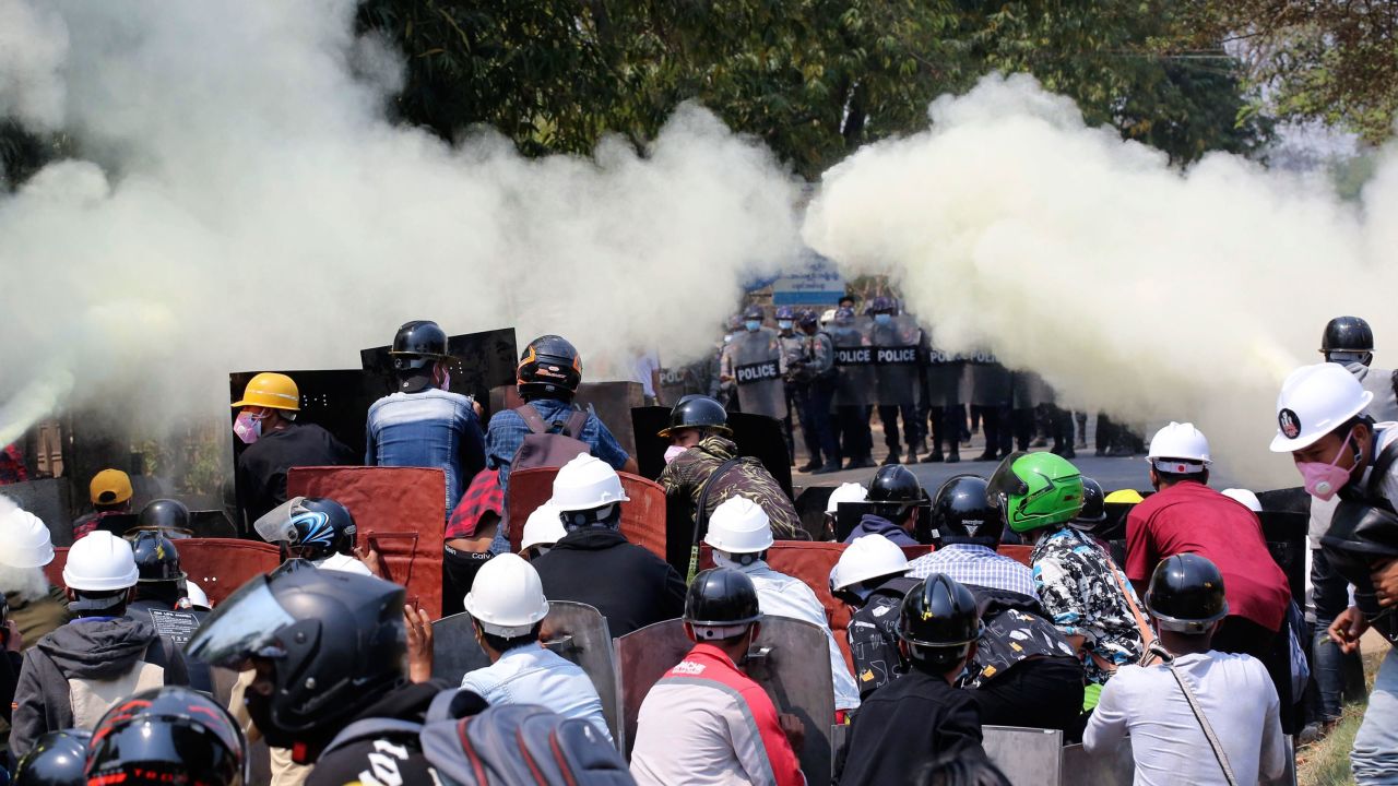Anti-coup protesters discharge fire extinguishers to counter the impact of the tear gas fired by police during a demonstration in Naypyitaw, Myanmar, on March 8.