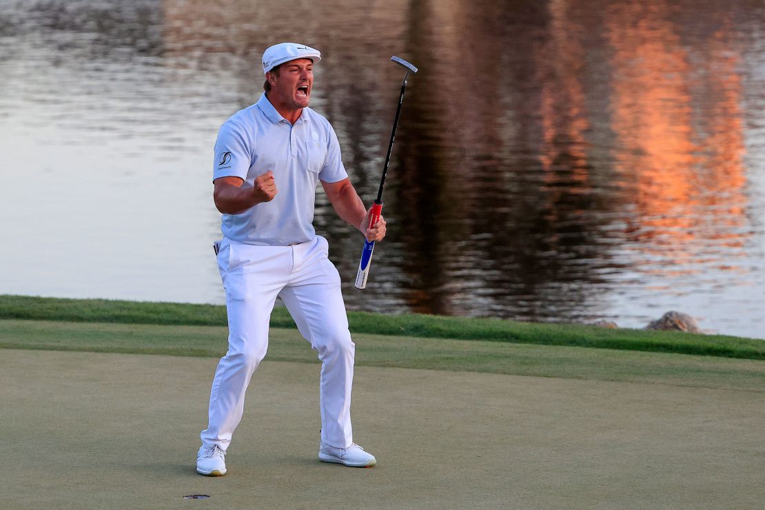 DeChambeau celebrates making his putt on the 18th green to win the Arnold Palmer Invitational.