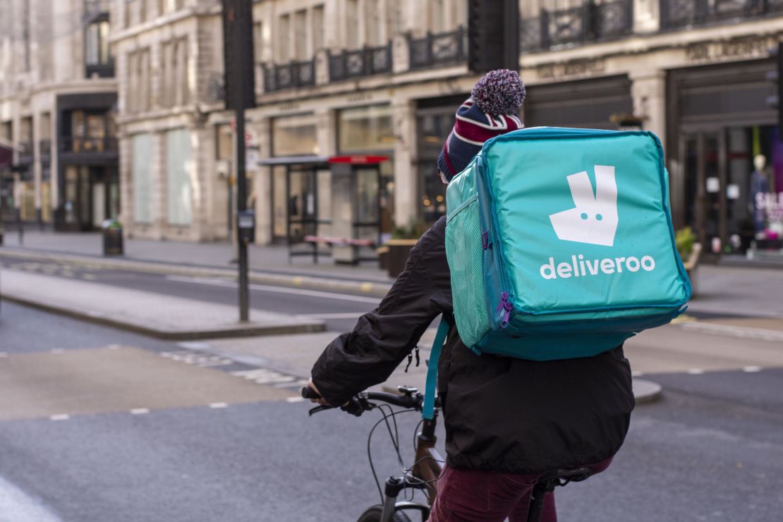 A Deliveroo rider delivering takeaway food  in central London.