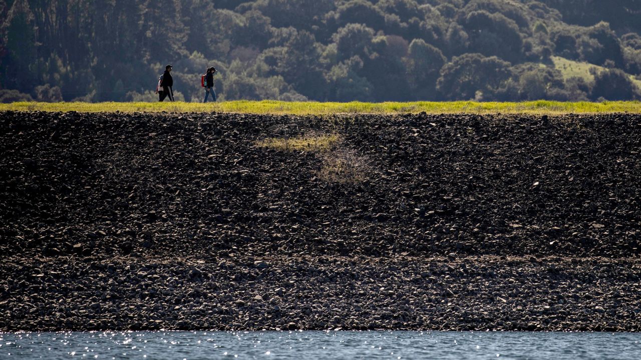 Hikers on Oursan trail along Briones Reservoir in Orinda, California on Sunday. The lack of rainfall this winter, and smaller snowpack, has awakened fears of drought.