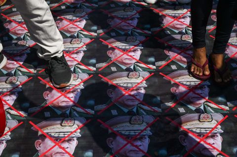 Protesters step on portraits of Myanmar's armed forces chief, Gen. Min Aung Hlaing, during a demonstration in Yangon on March 5.