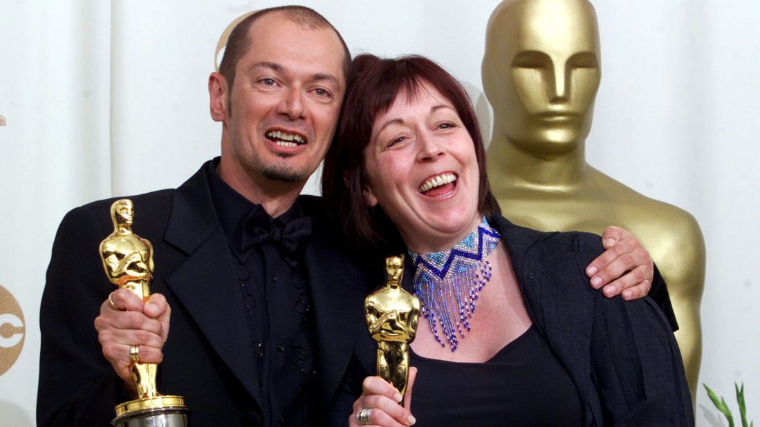 Trefor Proud (L) and Christine Blundell hold their Oscar statues after winning the Best Makeup category at the 2000 Academy Awards for their work on the film "Topsy-Turvy." Proud was born in Bulawayo, Zimbabwe, making him the first African to win in this category.