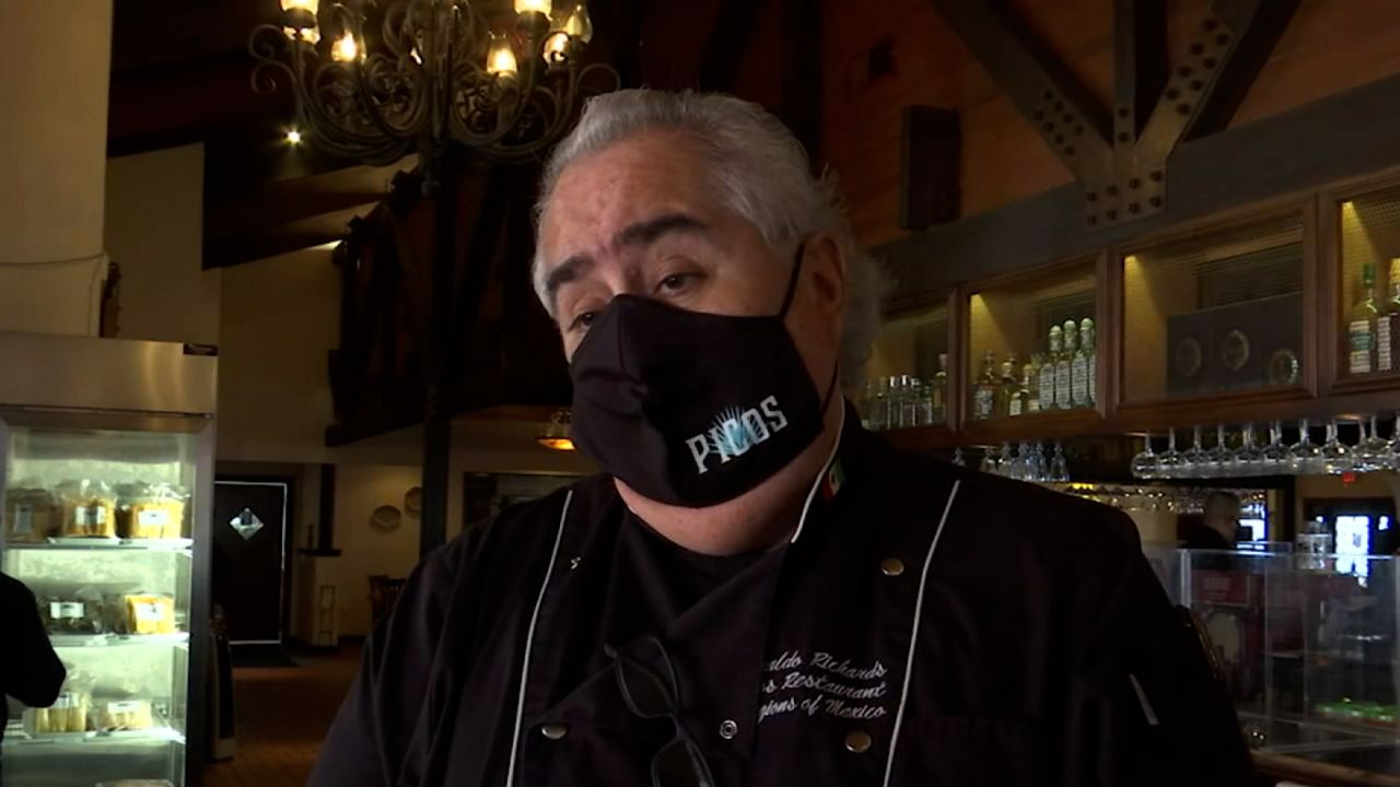 Arnaldo Richards is keeping a mask requirement to protect his family, staff and customers.