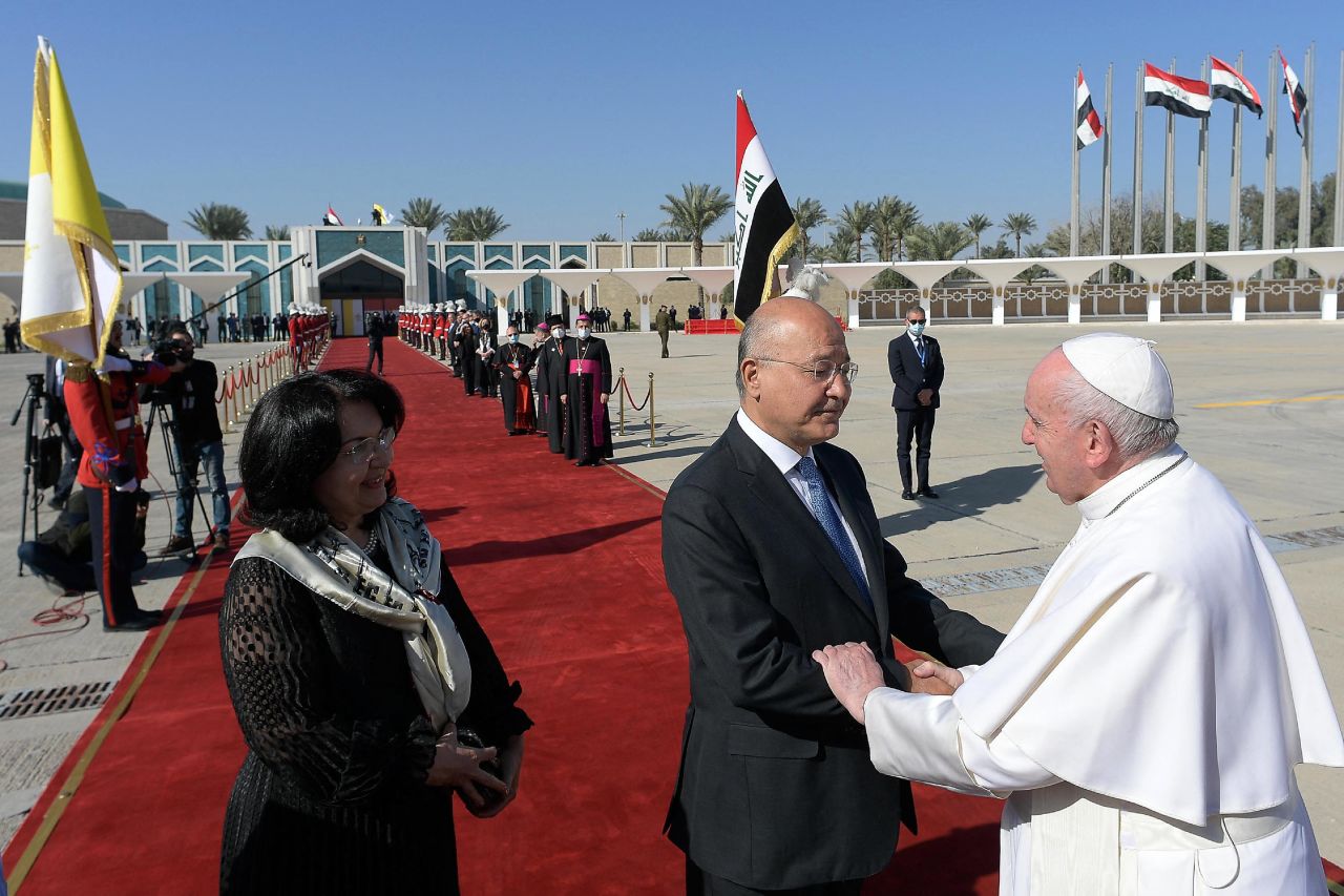 Iraqi President Barham Salih and his wife, Sarbagh, escort the Pope to his plane during his departure ceremony at Baghdad International Airport.