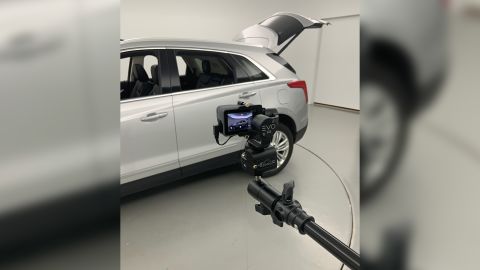 An SUV about to be listed for sale on CarMax's website is photographed using a camera that will create a fully rotatable 360-degree image. 