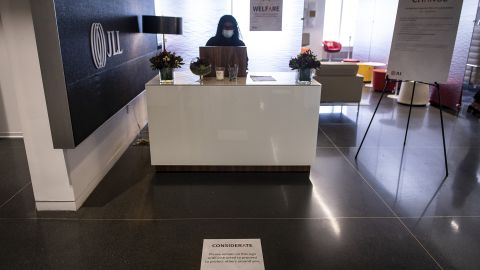 A social distancing marker is displayed in front of a reception desk at the JLL office in Chicago.