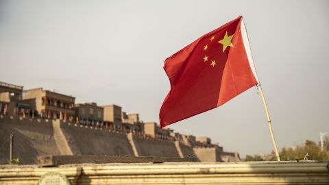 A Chinese flag flies outside the east gate of the Old City in Kashgar, Xinjiang, on November 8, 2018.