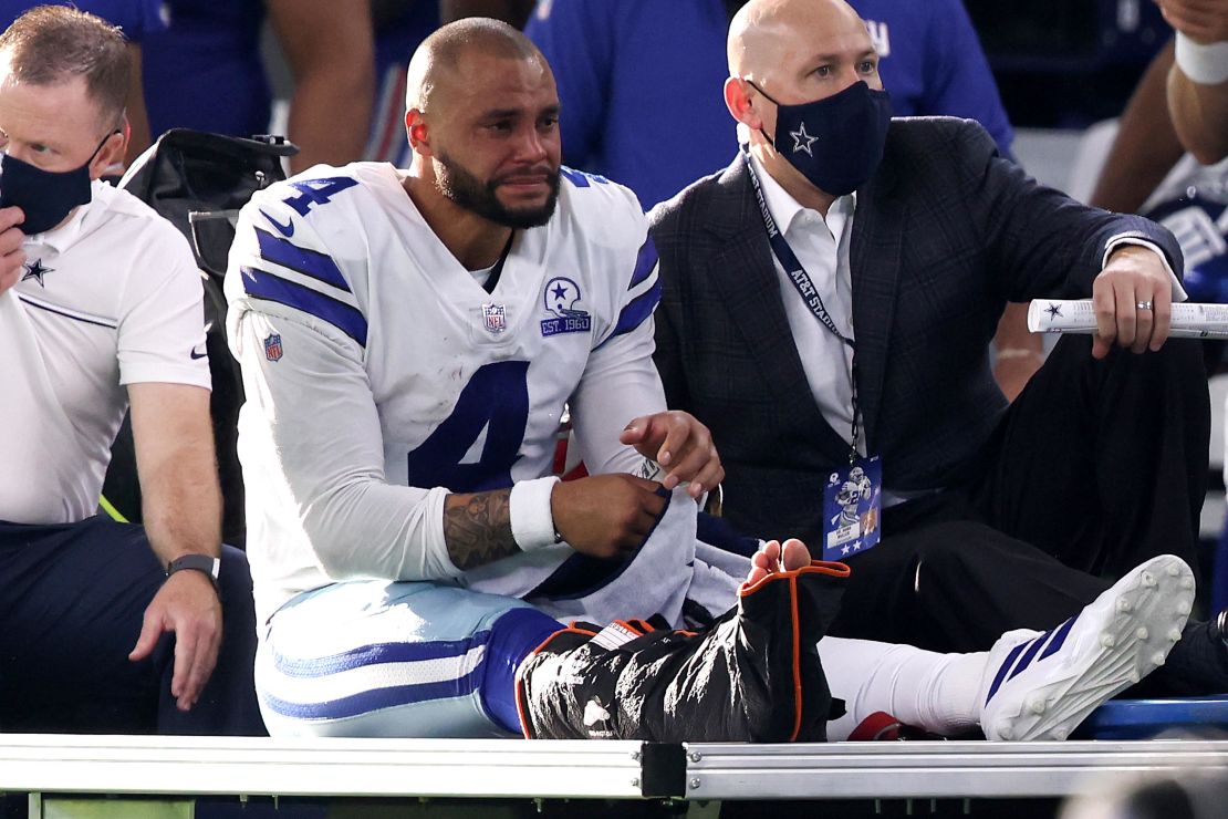 Prescott is carted off the field after sustaining a leg injury against the New York Giants. 