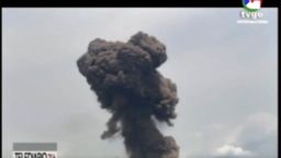 This TVGE image made from video shows smoke rising over the blast site at a military barracks in Bata, Equatorial Guinea, Sunday, March 7, 2021. 
