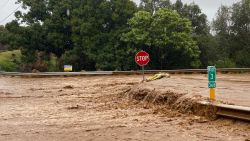 Floodwaters sweep over Hana Highway near West Kuiaha Road in Haiku, Maui, Hawaii, on Monday, March 8, 2021. Heavy rains caused a dam to overflow on the Hawaiian island of Maui, and and nearby residents in the community of Haiku are being evacuated, county officials said Monday.(Kehaulani Cerizo/The Maui News via AP)