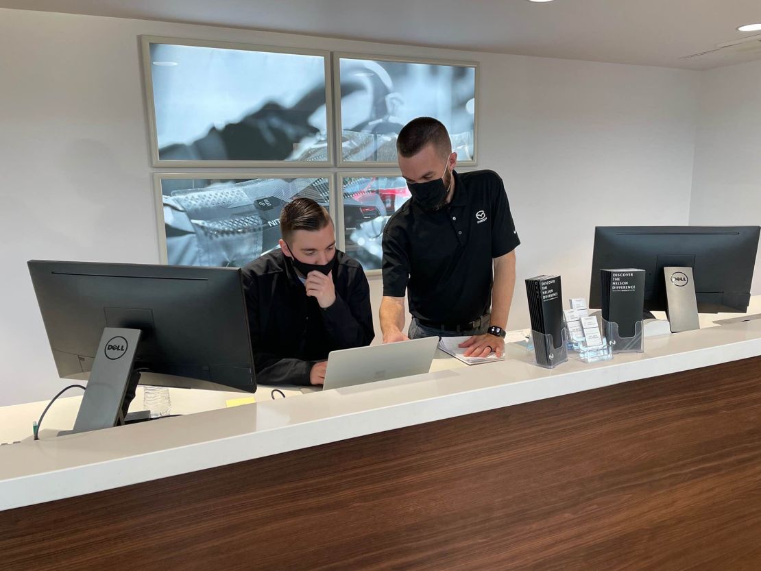 Online sales have dramatically changed business for Kyle Mountsier (standing), the marketing and business development director for Nelson Mazda in Franklin, Tennessee, who is seen here with team leader Tanner Hostetter.