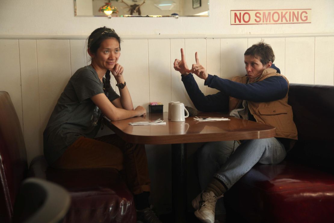 Writer/director Chloé Zhao on the set of "Nomadland" with actor and producer Frances McDormand.