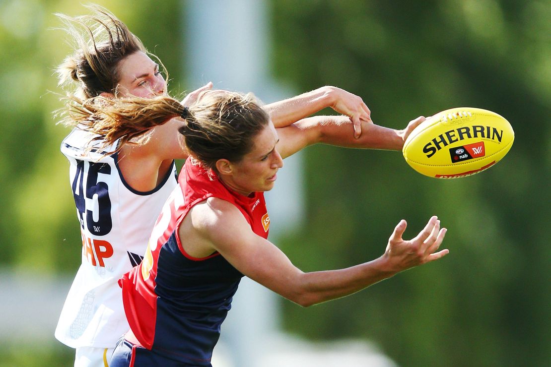 Phillips of the Demons (R) and Rheanne Lugg of the Crows compete for the ball during the round two AFLW match between the Melbourne Demons and the Adelaide Crows at Casey Fields on February 10, 2018 in Melbourne, Australia.