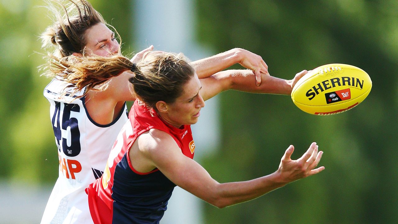 Phillips of the Demons (R) and Rheanne Lugg of the Crows compete for the ball during the round two AFLW match between the Melbourne Demons and the Adelaide Crows at Casey Fields on February 10, 2018 in Melbourne, Australia.