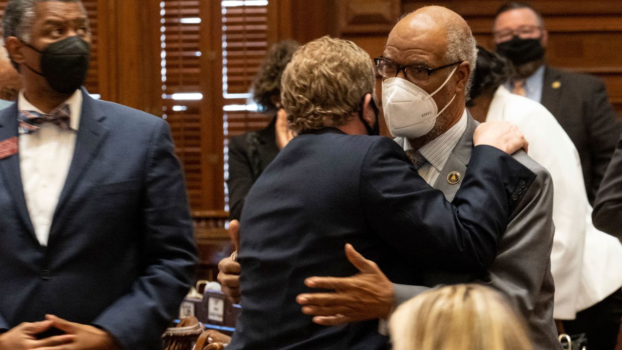 Rep. Bert Reeves left, hugs Rep. Calvin Smyre after the unanimous passage of HB 479 on Monday.