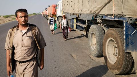 Trucks lined up on a road outside Hodeidah, fully laden but with no fuel to leave.
