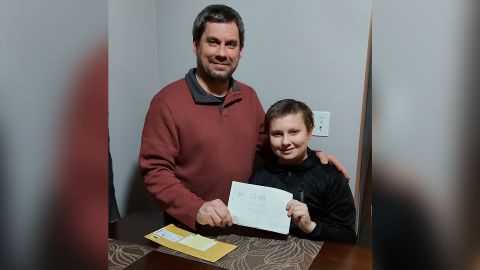 Austin Hutton, left, was about the same age as his son A.J. when he wrote his private diary for Mr. Brittain's class in 1988. The teacher mailed it to him after all these years.