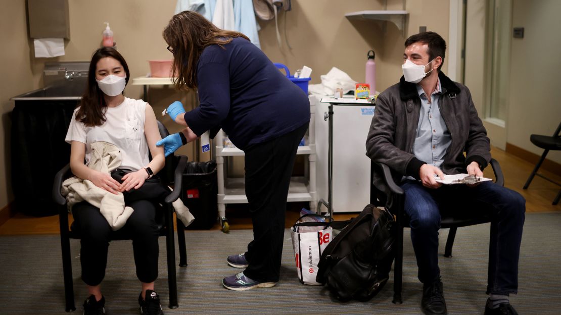  United Airlines flight attendants receive Covid-19 vaccines at United's onsite clinic at O'Hare International Airport on March 9, 2021 in Chicago, Illinois
