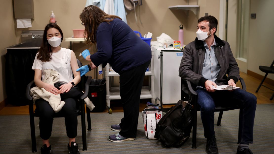 United Airlines flight attendants receive Covid-19 vaccines at United's onsite clinic at O'Hare International Airport on March 9, 2021 in Chicago, Illinois