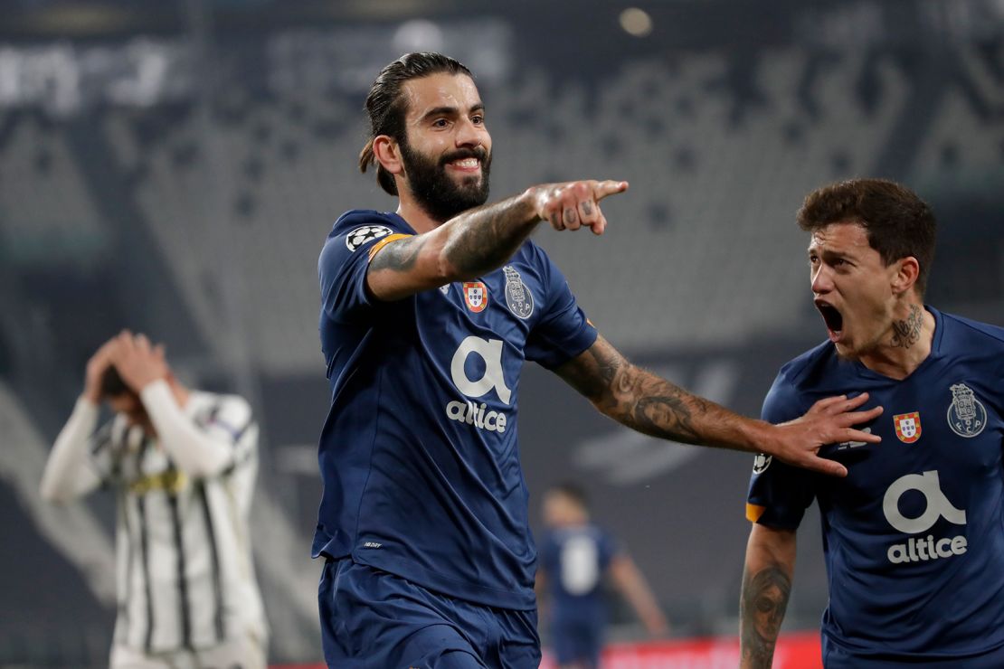 Oliveira celebrates with Otavio (right) after scoring the opening goal against Juventus.