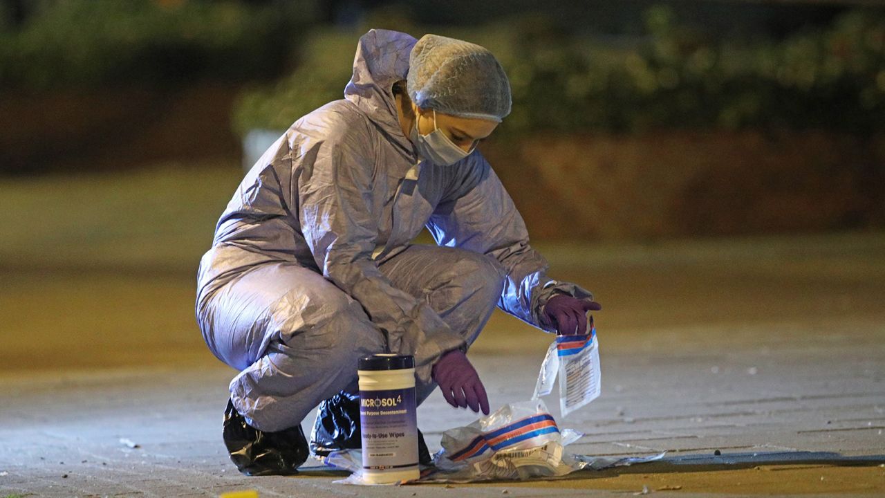 A forensics officer in the the search.