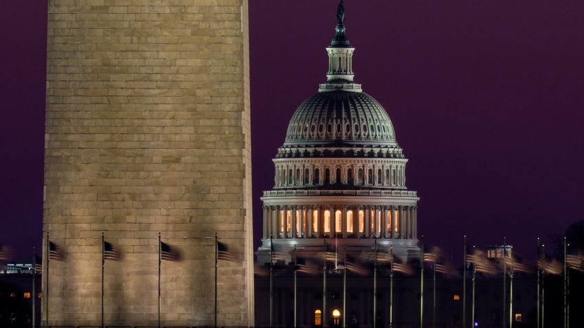 The Capitol is seen beyond the base of the Washington Monument before sunrise in Washington, Wednesday, March 10, 2021. (AP Photo/Carolyn Kaster)