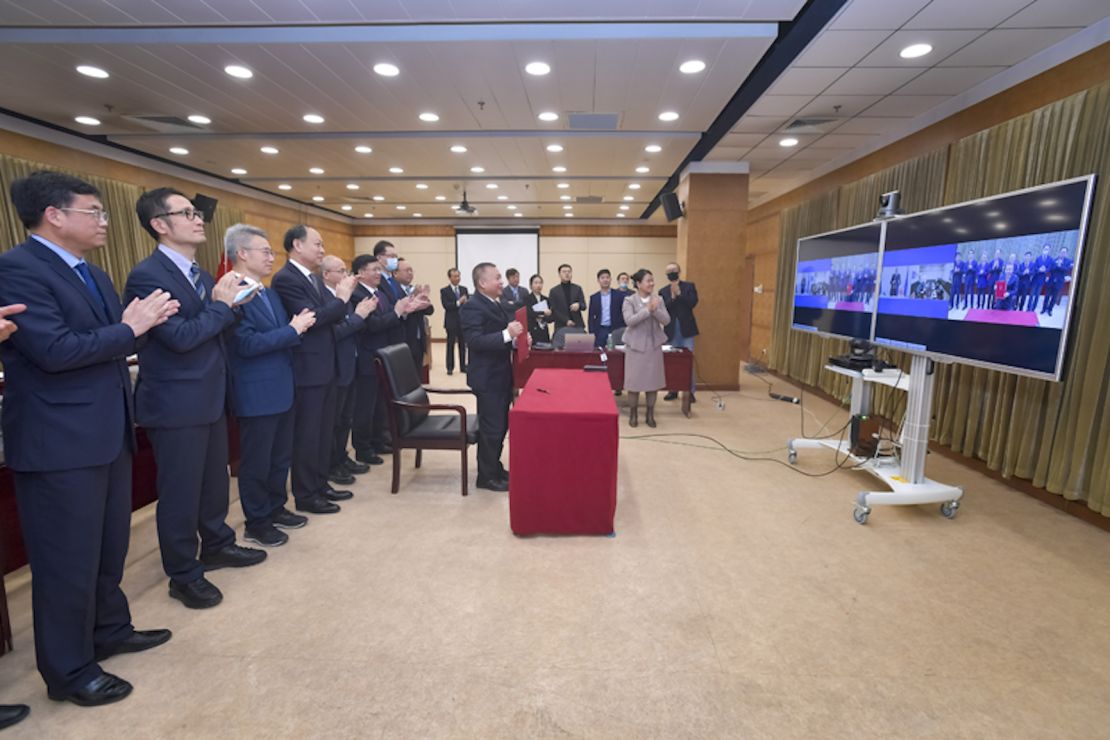Members of the China National Space Administration during the joint signing with Russian space agency Roscosmos on March 9, 2021.