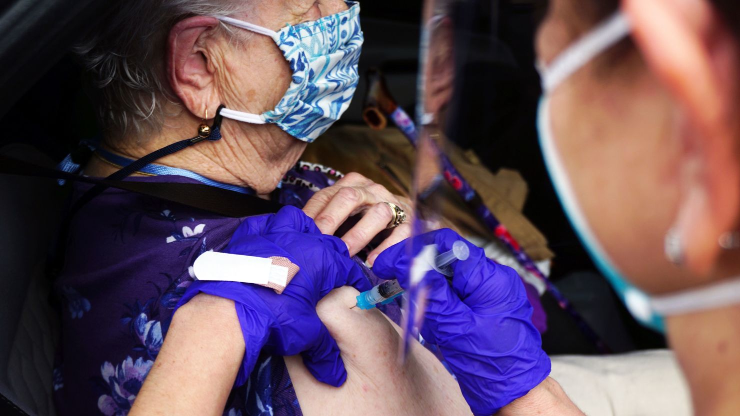 A COVID-19 vaccine is administered, Friday, Feb. 5, 2021, in Brownsville, Texas, during a vaccination clinic at Texas Southmost College (TSC) ITEC Center. (Miguel Roberts/The Brownsville Herald via AP)