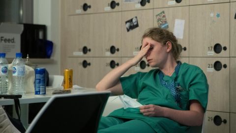 Health care workers around the world are feeling depressed and anxious from the stresses of the pandemic. Nurse Mathilde Dumont, 27, is shown at the Ixelles Hospital in Brussels.