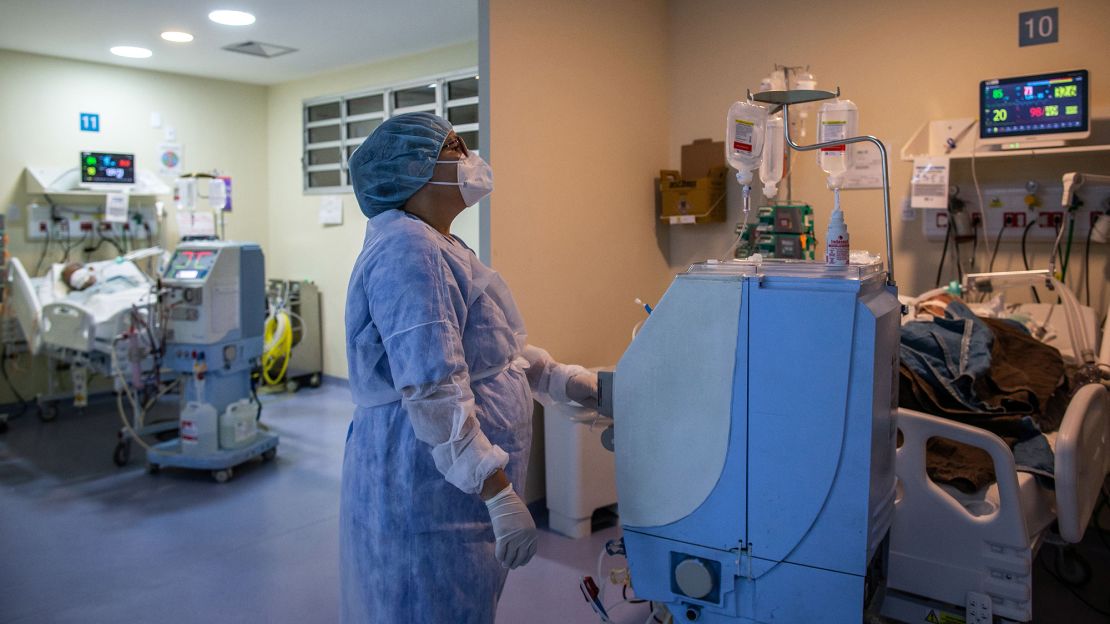 A health worker cares for a COVID-19 patient at an Intensive Care Unit (ICU) of the Ronaldo Gazolla Public Municipal Hospital in Rio de Janeiro, Brazil, on March 5, 2021.