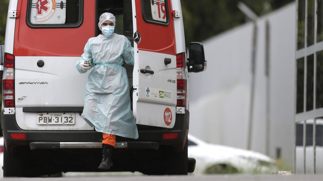 A healthcare worker takes a patient to a hospital in Brasilia, Brazil on March 8.