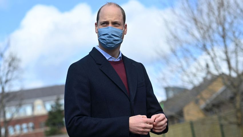 Britain's Prince William, Duke of Cambridge reacts to a question from the media as he leaves after a visit to School21 following its re-opening after the easing of coronavirus lockdown restrictions in east London on March 11, 2021. - The visit coincides with the roll-out of Mentally Healthy Schools resources for secondary schools and how this is helping put mental health at the heart of their schools curriculum. (Photo by JUSTIN TALLIS / various sources / AFP) (Photo by JUSTIN TALLIS/AFP via Getty Images)