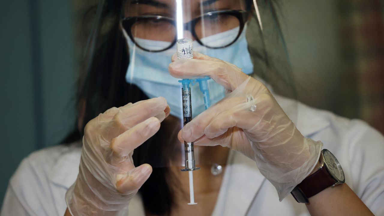 Walgreens pharmacist Jessica Sahni administers the Pfizer-BioNTech COVID-19 vaccine at the New Jewish Home in Manhattan on December 21, 2020 in New York City.