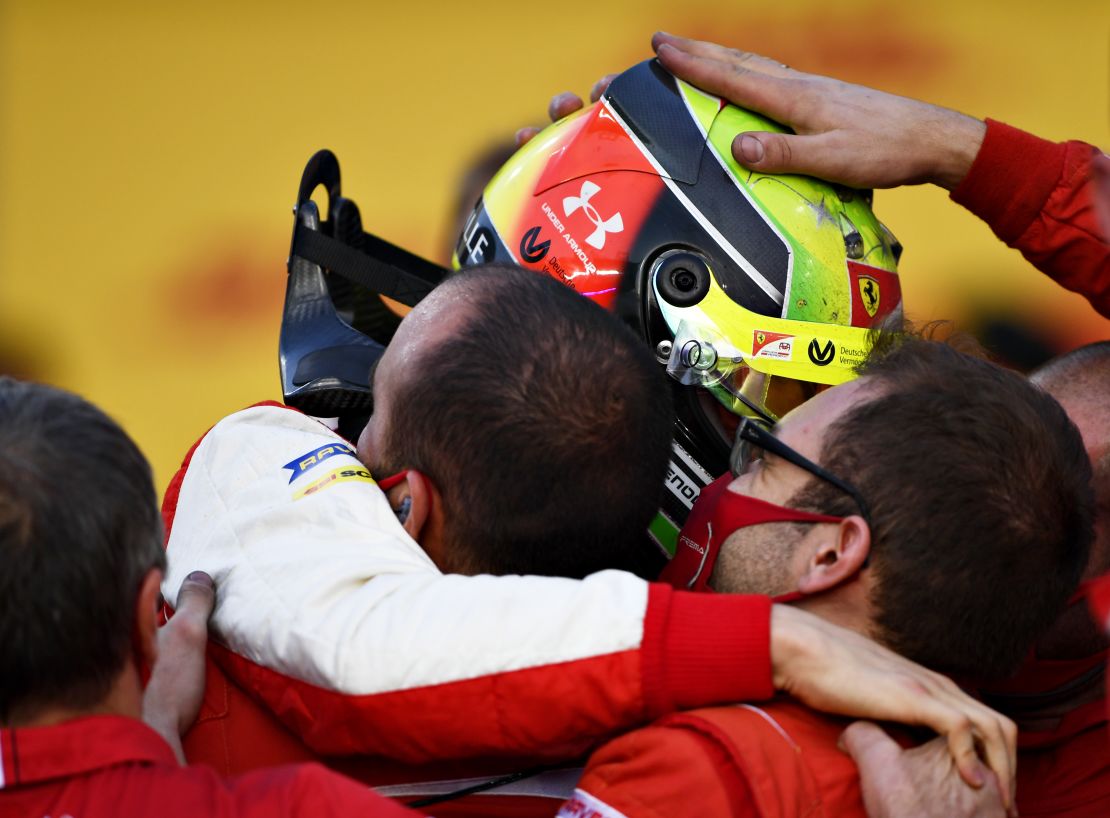 Mick Schumacher celebrates with the Prema Racing after winning the F2 championship.