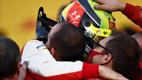 Mick Schumacher celebrates with the Prema Racing after winning the F2 championship.
