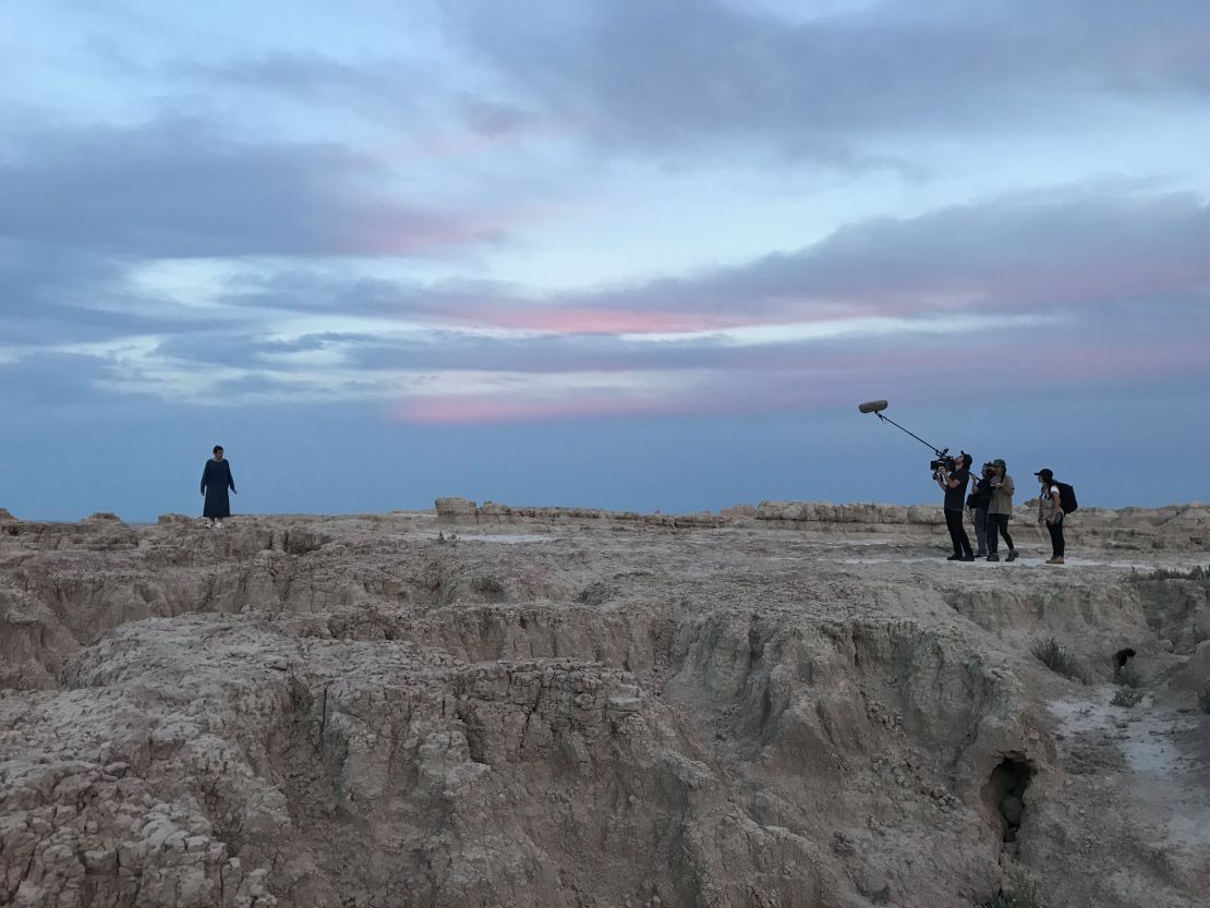 Frances McDormand and crew shooting "Nomadland" in Badlands National Park, South Dakota.