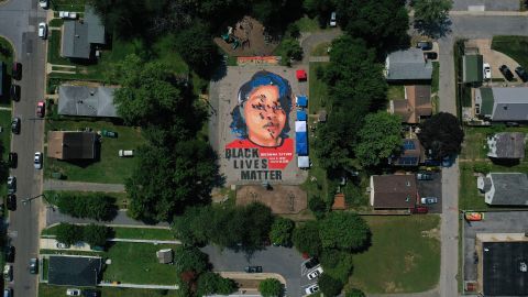 In an aerial view from a drone, a large-scale ground mural depicting Breonna Taylor with the text "Black Lives Matter" is seen being painted at Chambers Park on July 5, 2020 in Annapolis, Maryland.