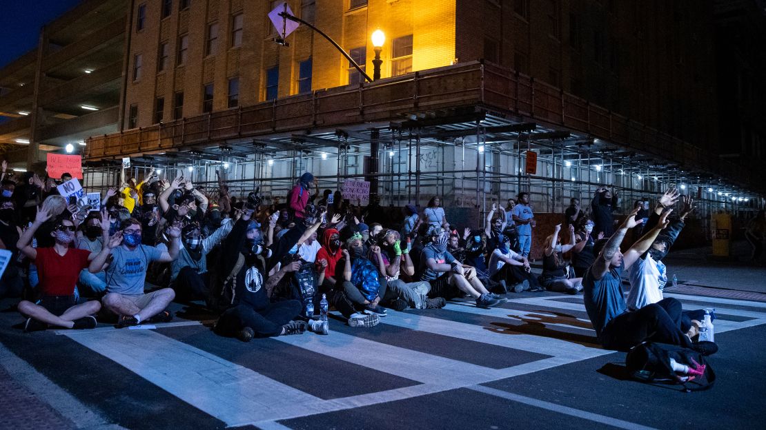 Protesters gather after nightfall in Louisville, Kentucky, last year. 