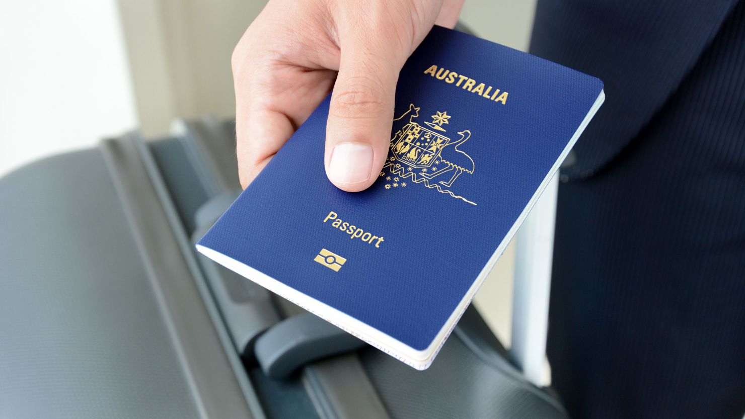 A traveler carries an Australian passport